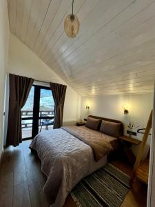 a bedroom with a large bed in a room at Villa Pelahia in Slavske