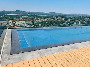 a swimming pool on the roof of a building at Menlyn Maine Luxury Apartments 11th & 14th floor with Balcony in Pretoria