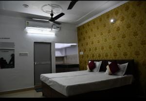 Postelja oz. postelje v sobi nastanitve Ram Madaiya Home stay