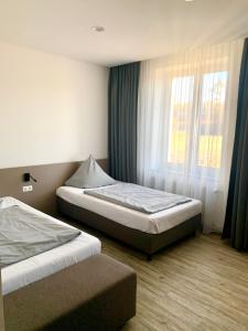 Postel nebo postele na pokoji v ubytování boardinghouse Main-Tauber