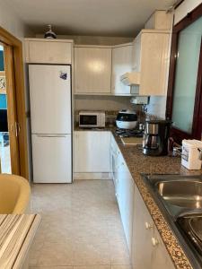 Kuchyň nebo kuchyňský kout v ubytování Charm Apartment 90m2