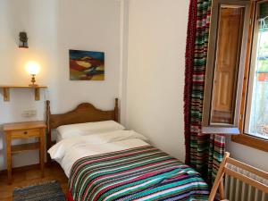 Postel nebo postele na pokoji v ubytování Hotel los Bérchules