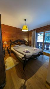 a bedroom with a large bed in a room at Alpenblick Leukerbad in Leukerbad