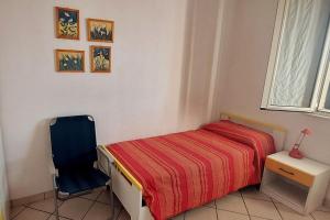 Giường trong phòng chung tại Holiday House Casa Vacanze Vento di Mare
