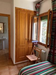 Postel nebo postele na pokoji v ubytování Hotel los Bérchules