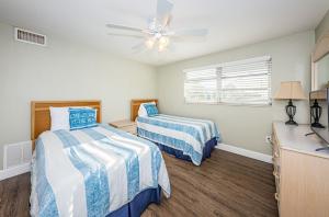 Llit o llits en una habitació de Villa 49 - Aloha Kai Vacation Villas