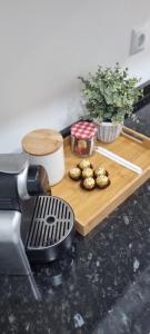 a cutting board with some food on a table at Chinde Guesthouse in Lisbon