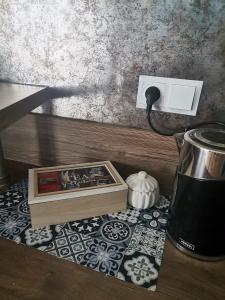 a electrical outlet with a box on a table at Apartament Widok Polana Szaflarska in Nowy Targ
