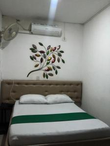 Cama o camas de una habitación en hotel prados del chicamocha
