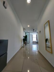 a hallway with a mirror and a ceiling fan at 3 Elements* The Garden* MRT2* Wifi* Self Check-In in Kampong Batu Sembilan