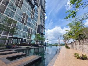 a river in a city with tall buildings at 3 Elements* The Garden* MRT2* Wifi* Self Check-In in Kampong Batu Sembilan