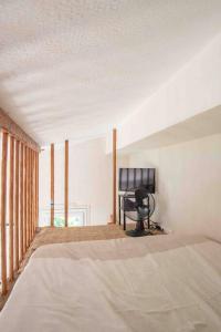 Appartement climatisé en plein centre avec balcon tesisinde bir odada yatak veya yataklar