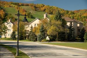 a street light on the side of a road with houses at Mountain Walk by Property Valet in Blue Mountains