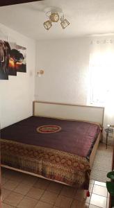 a bedroom with a large bed in a room at Apartments Happy Day in Karlobag