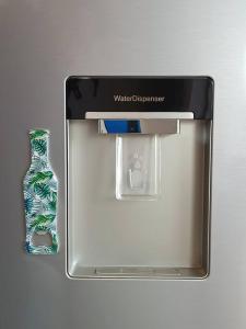 a glass bottle in a box on a table at Кокетен апартамент VeRa Suite in Silistra