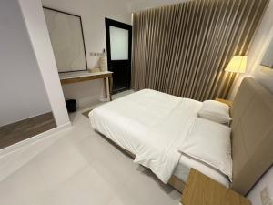 En eller flere senge i et værelse på Divon Chalets