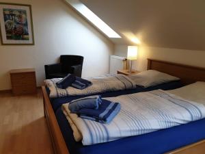 Postel nebo postele na pokoji v ubytování Ferienhaus Jantje Moe 3