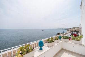 a view of the ocean from the balcony of a building at B&b Casa Maredentro in Monopoli