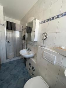 Ένα μπάνιο στο Ferienwohnung Oswald