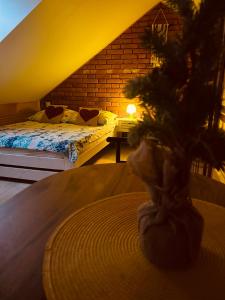 a bedroom with two beds and a christmas tree on a table at Panorama Świętokrzyska in Górno