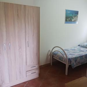 Кровать или кровати в номере Andi