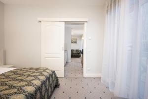 Postel nebo postele na pokoji v ubytování Art Hotel