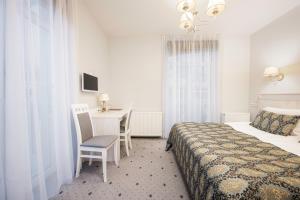 Postel nebo postele na pokoji v ubytování Art Hotel