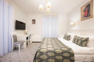 Postel nebo postele na pokoji v ubytování Art Hotel