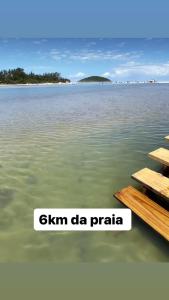 an island in the middle of a body of water at Casa de Praia in Imbituba