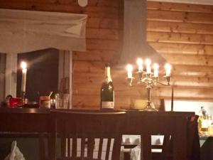 a bottle of wine sitting on top of a bar at Stunning6B2B views,jacuzzi,sauna in Sättra