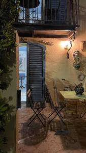 a patio with two chairs and a table in a room at La Maisonette Antibes in Antibes