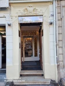 an entrance to a store with a sign over the door at Hôtel des allées in Marseille