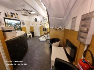 a room with a bathroom with a sink and a mirror at Hôtel des allées in Marseille