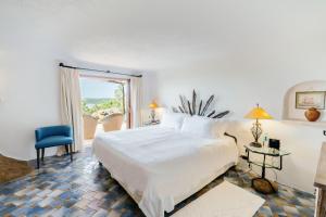 Postel nebo postele na pokoji v ubytování Hotel Pitrizza, Costa Smeralda