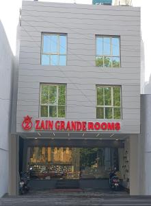 a store with a sign that reads jam grandade rooms at Hotel Zain Grande in Chennai