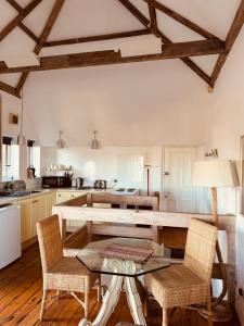 a kitchen with a table and two chairs at Longsands Beach, Apartment 3, Tynemouth in Tynemouth