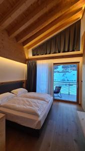 Postel nebo postele na pokoji v ubytování Vetta Alpine Relax