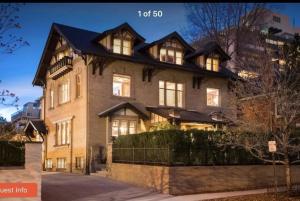 a large house with a gambrel roof at Knight Campbell Carriage House in Denver