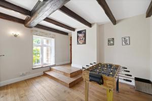 an empty room with a ping pong table at Hot-Tub Heaven in Bristol - Games Room in Bristol