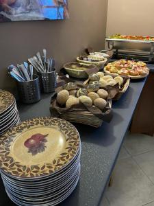 a table with plates of food on top at Good Spot Zieleniec Twin Eco 01 in Duszniki Zdrój