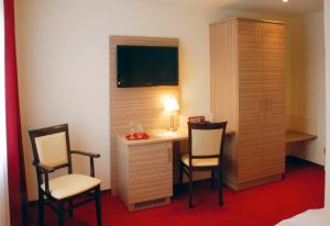 TV a/nebo společenská místnost v ubytování Hotel Mühleneck