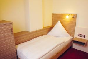 Postel nebo postele na pokoji v ubytování Hotel Mühleneck