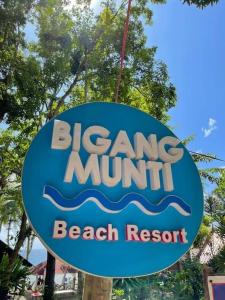 a sign for a beach resort on a pole at Cabin A at Bigang Munti in Batangas City