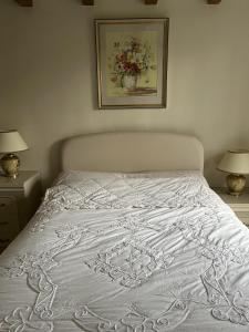 Krevet ili kreveti u jedinici u okviru objekta Luxury Brick and Flint House in Funtington