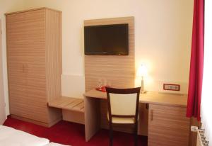 TV a/nebo společenská místnost v ubytování Hotel Mühleneck