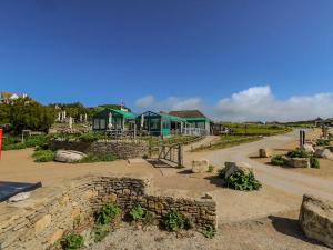 a building with a road in front of it at Alice's Cottage in Bridport