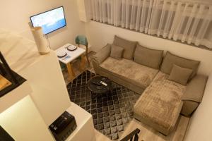 Posezení v ubytování Cozy Loft-Blloku Downtown