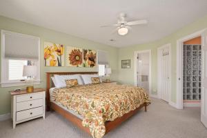 a bedroom with a bed and a ceiling fan at MS15 Sound View in Nags Head