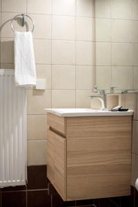 a bathroom with a sink and a towel at Leggero in Preveza +31 photos