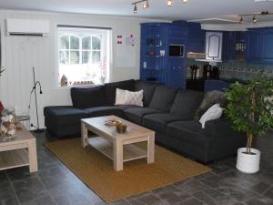 a living room with a couch and a table at "Huset Alcamaro" 